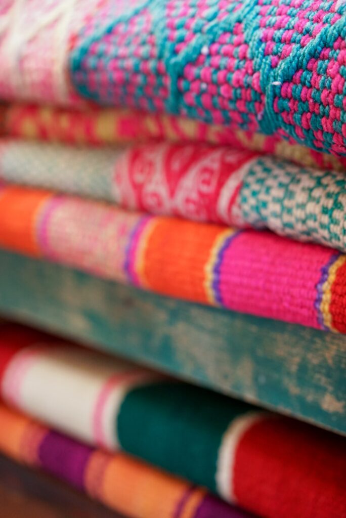 Colourful rugs piled up